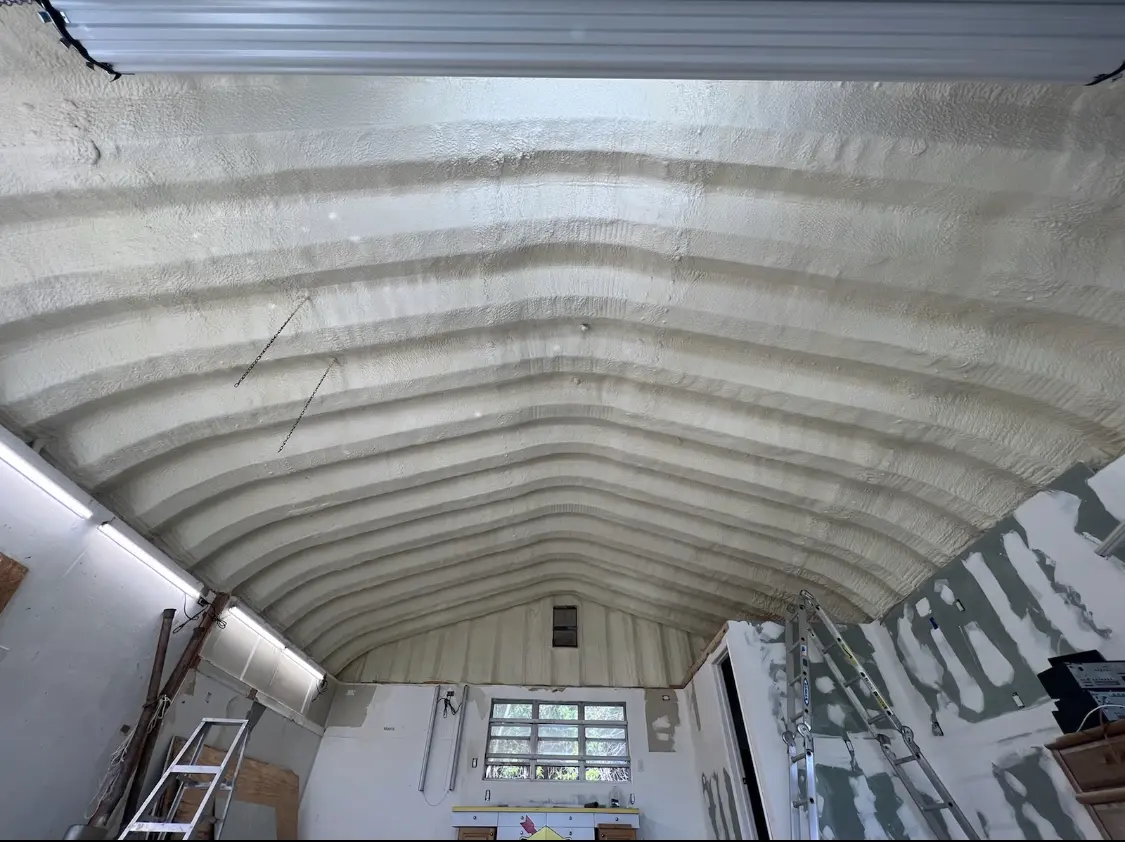 Spray polyurethane foam applied to the underside of a metal roof deck in Garnet
